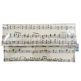 Foldable clutch with music sheet design on a white background