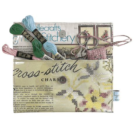 Vintage 1950's magazine wallet with cross stitch charm and PVC cover, handmade and lined with embroidery kit ad.
