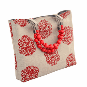Iron Flowers handprinted natural linen shopper bag with red beaded handles and nickel frame