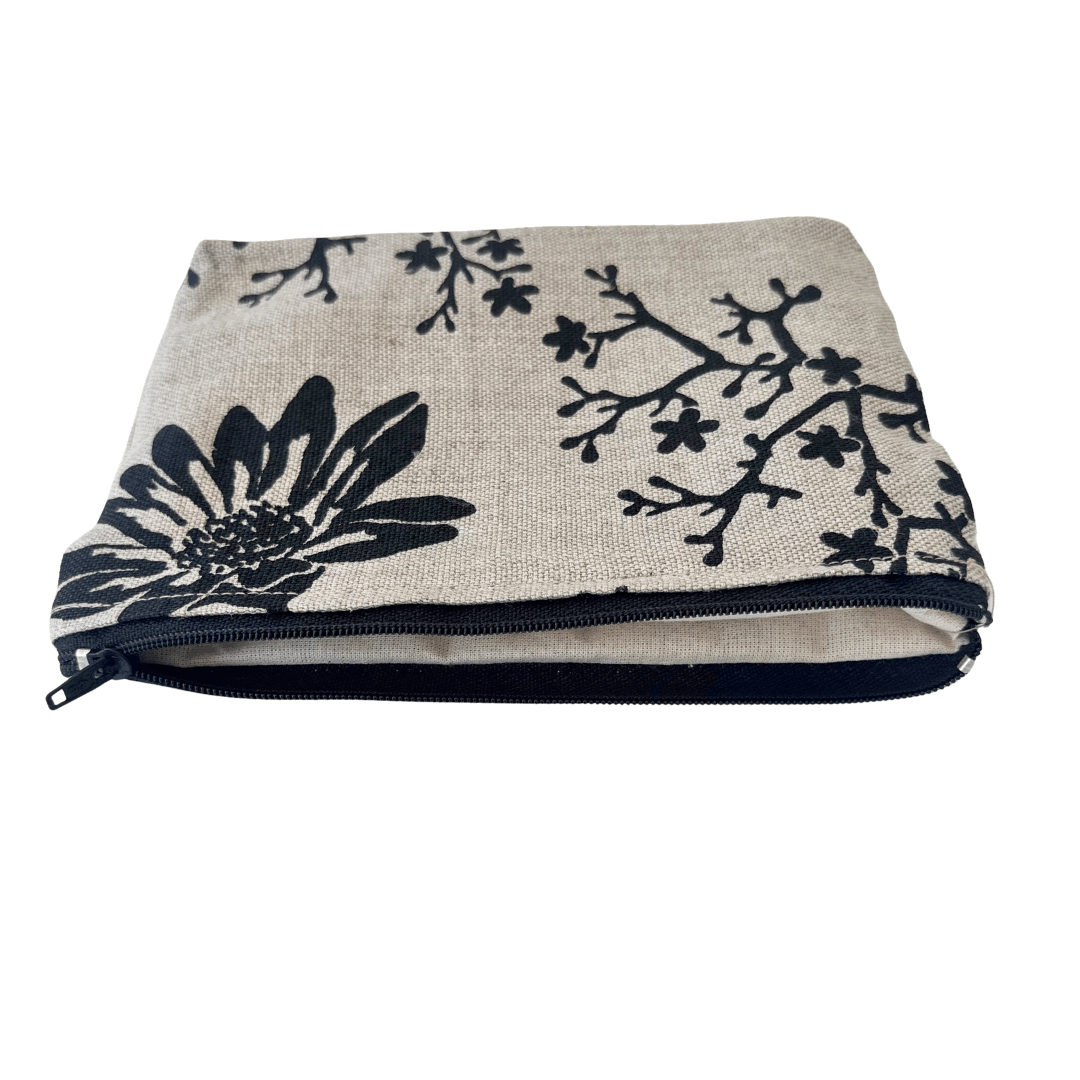 Floral patterned pouch with a zipper on a white background