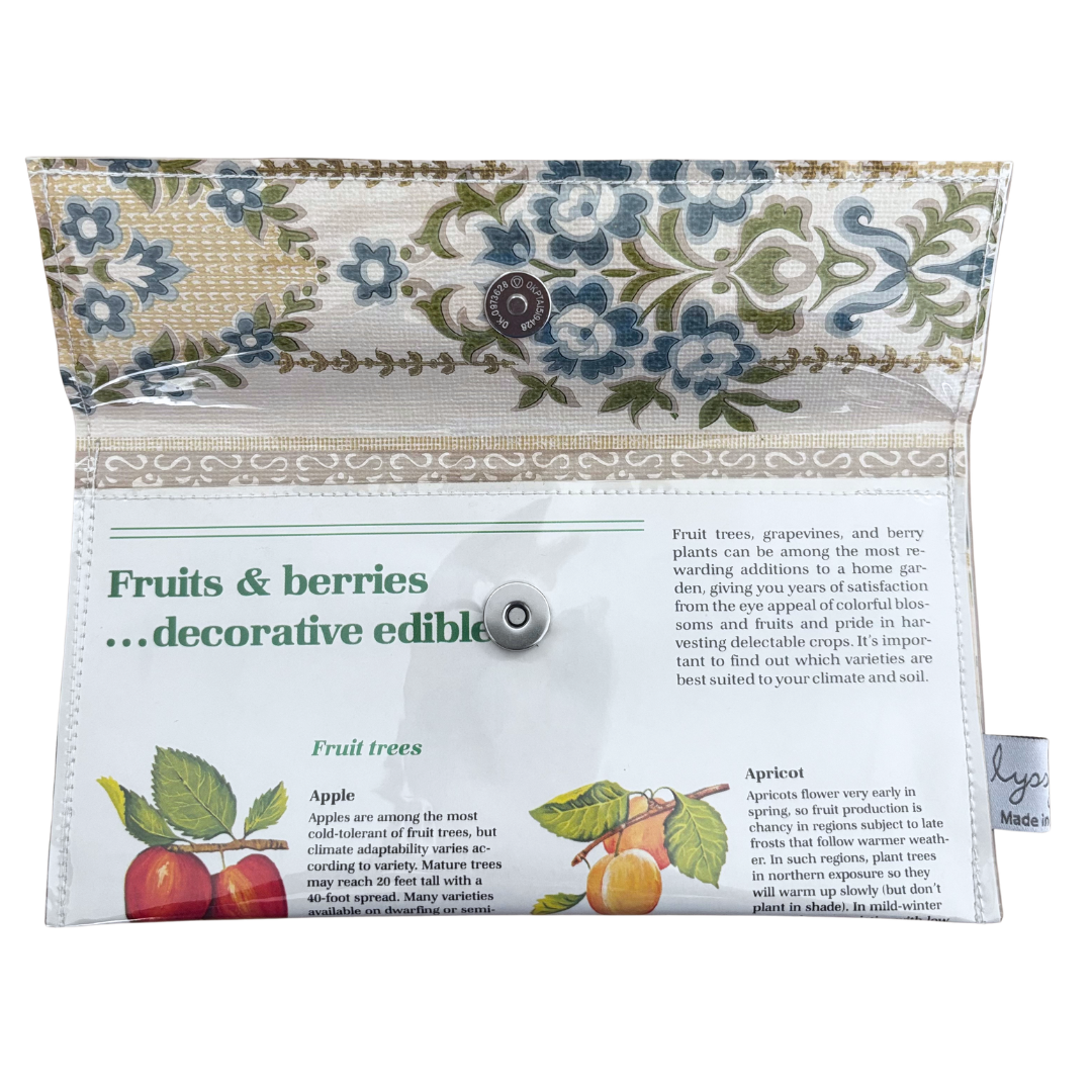 Decorative pouch with floral pattern and educational text on fruits and berries.