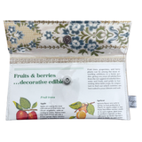 Decorative pouch with floral pattern and educational text on fruits and berries.