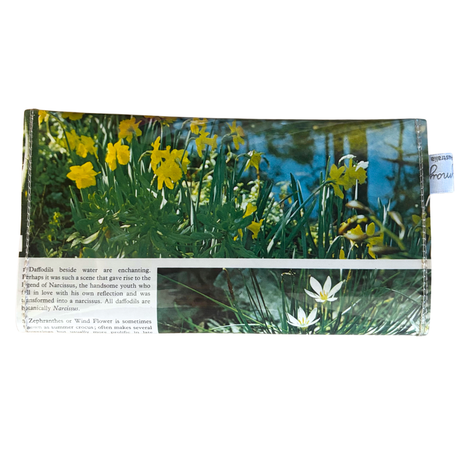 wallet with images of yellow daffodils and greenery on a white background