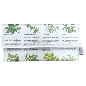 handmade wallet with herb illustrations and text on a white background