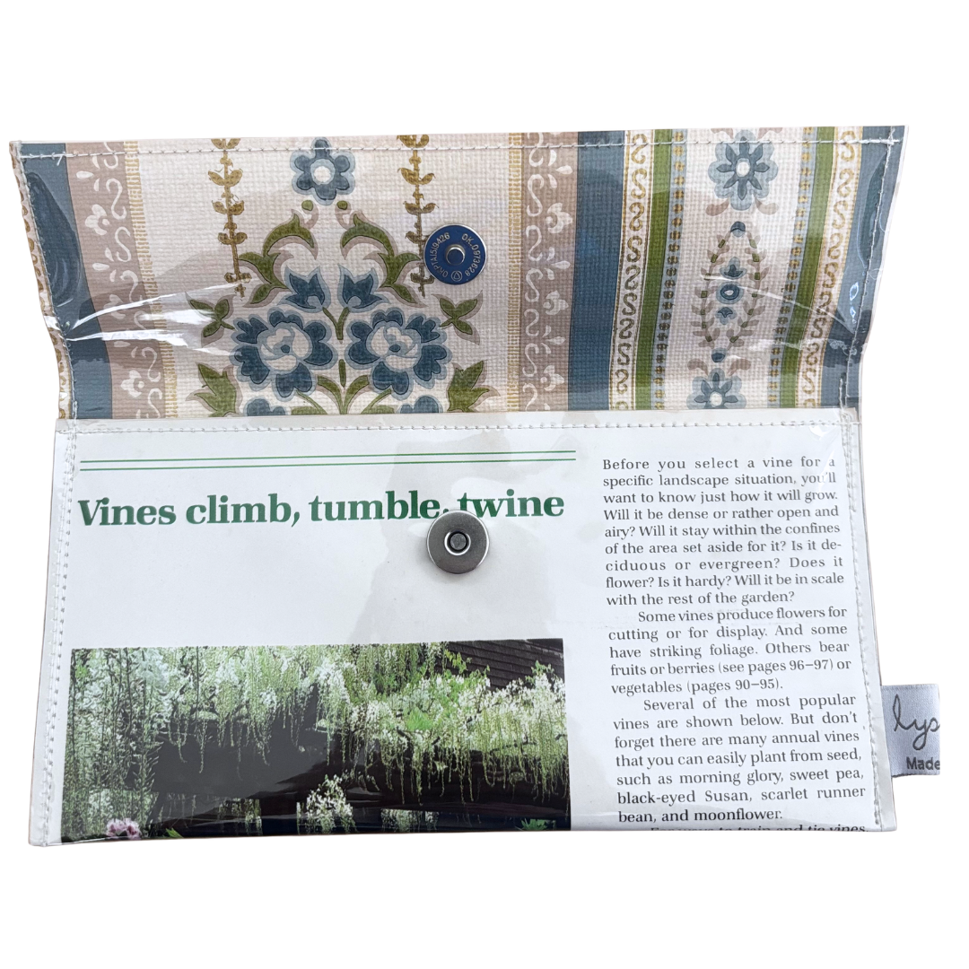 handmade wallet with floral pattern and educational text on a white background