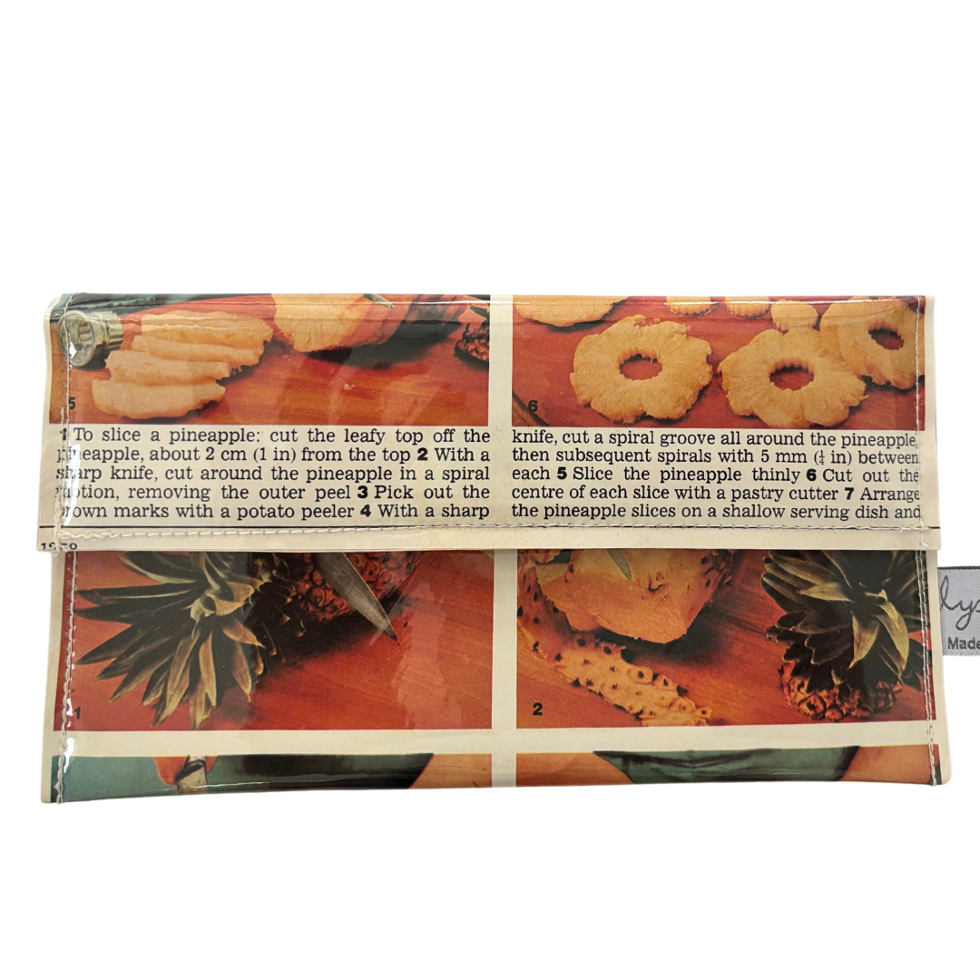 handmade wallet featuring original pages of a retro recipe book featuring pineappples