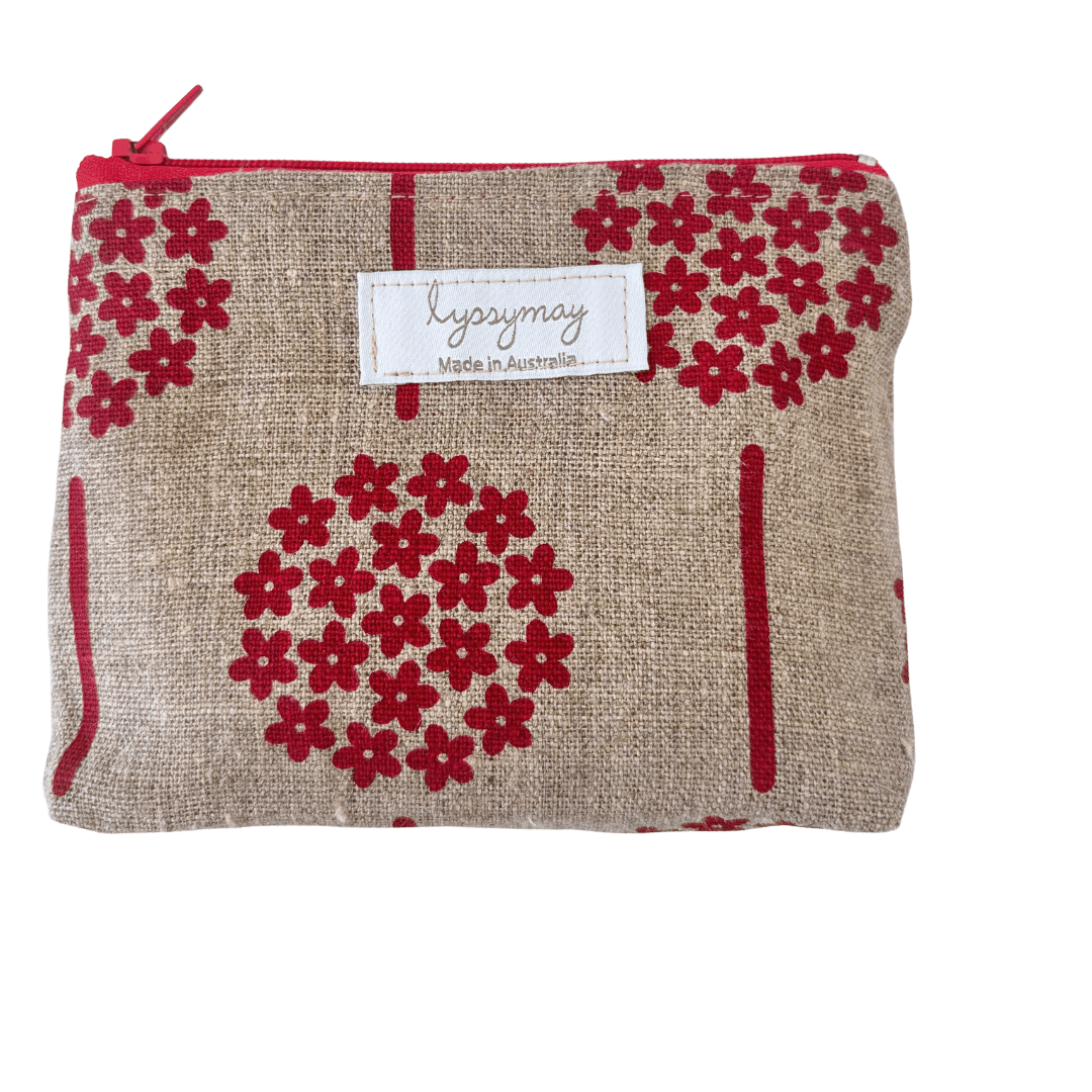 Fabric pouch with red floral pattern and 'lyssymay' label on a white background