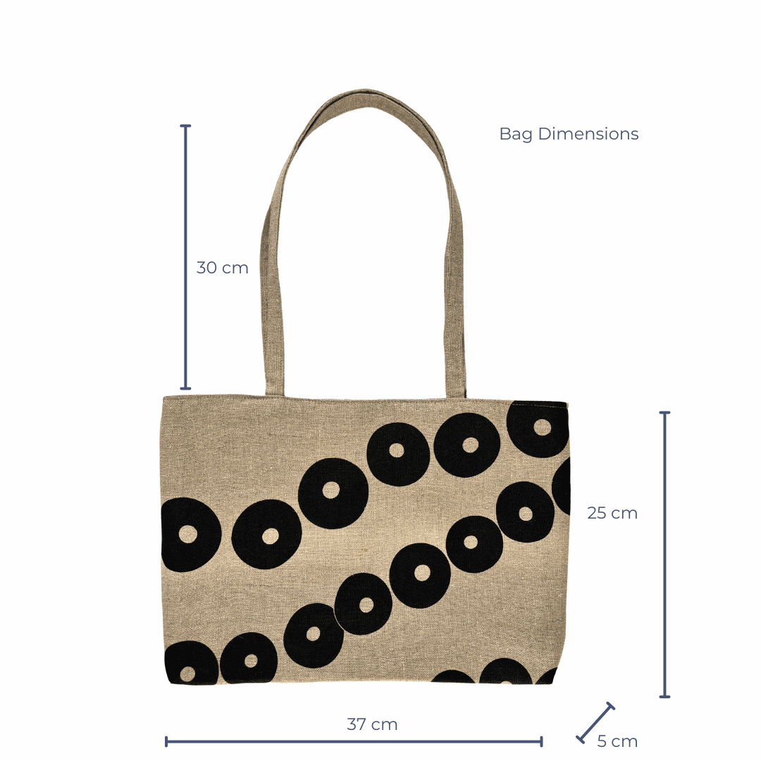 Tote bag with black circular pattern and dimensions on a white background