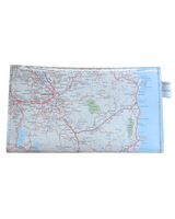 Back view of handmade wallet featuring Tasmania by Lyssy May with a clear plastic cover and metal buttons on a white background