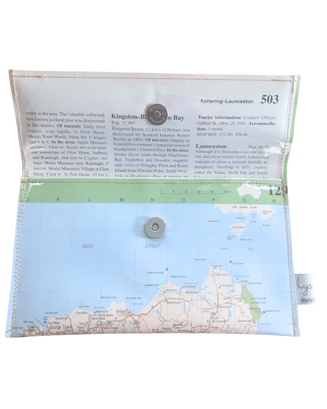Back view of handmade wallet featuring Tasmania by Lyssy May with a clear plastic cover and metal buttons on a white background lined with information page