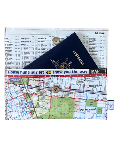 Map of Melbourne with a passport made as a wallet by Lyssy May against a white background