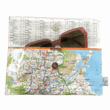 Recycled street map wallet featuring Brisbane suburbs design made from original UBD map pages with clear PVC protection and magnetic closure